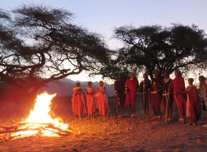 In the evening, we gather round the campfire for a special farewell celebration to our unforgettable adventure in Tanzania.