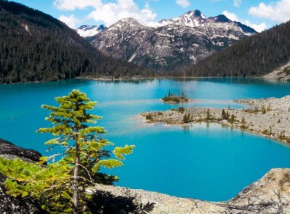 Experience crystal blue alpine lakes after hiking through lush rainforests on this adventure showcasing favorite British Columbia hikes.