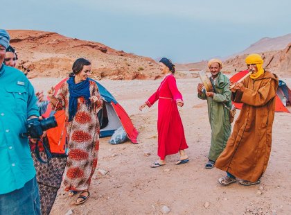 Travellers and Berbers dancing at Sahara Desert Camp, Morocco
