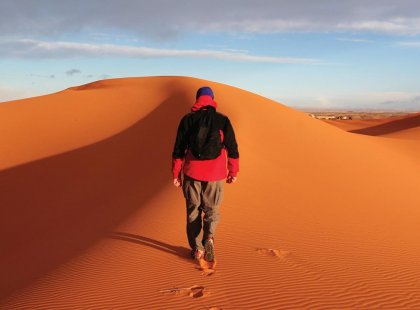 Take a walk over the dunes in the Sahara Desert