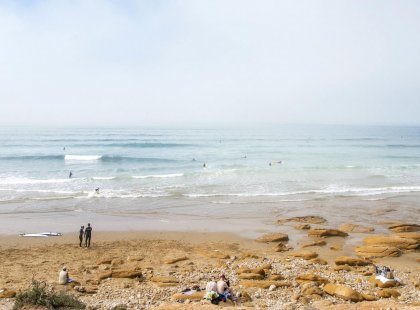 Surfers in the sea in Taghazout, morocco
