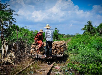 Locals riding the bamboo train in Battambang, Cambodia as seen on an Intrepid Travel tour