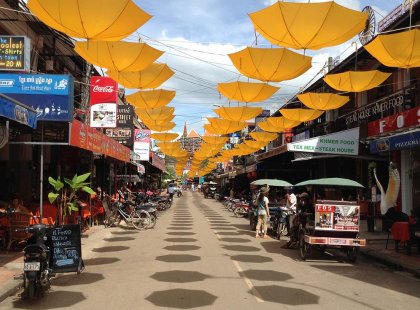 Yellow umbrellas act like an urban canopy on Pub Street in Siem Reap, Cambodia.
