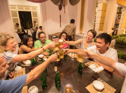 vietnam mekong ho chi minh city traveller group beer toast leader