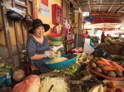 A local street vendor selling vegetables in Hoi An, Vietnam