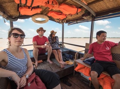 An Intrepid Travel group on a Mekong Delta boat tour in Vietnam.