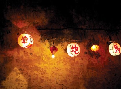 Traditional vietnamese lights hanging in the streets of Hoi An on an Intrepid Travel tour.