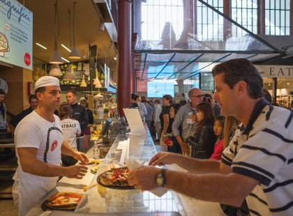 Eat pizza at the Centrale Market in Florence, Italy