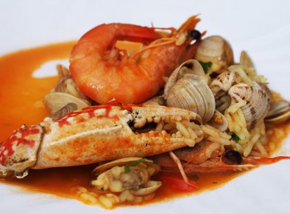An example of fresh seafood cooked in a traditional Portugese sauce.