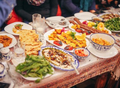 Sitting down for a homemade Dinner on Iran Real Food Adventure