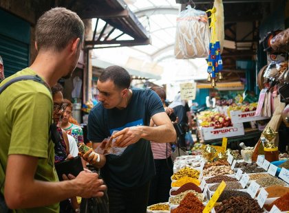 Travellers looking at spice market, Israel