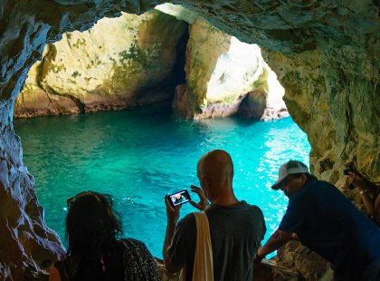 Group of travellers viewing grotto cave, Rosh Hanikra, Israel & the Palestinian Territories