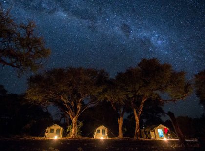 Bask in the glow of the Milky Way while enjoying classic safari camping in Africa’s renowned Okavango Delta.
