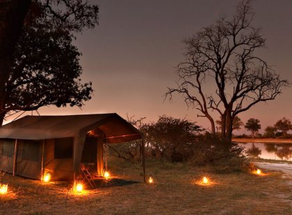 Experience classic safari camping in large canvas-sided tents comprised of three sections: veranda, bedroom, and private bathroom with a safari shower.