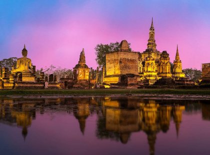 View the pinnacle of the Khmer Empire, Angkor Wat, at sunset and during a day’s biking adventure through the temple complex.