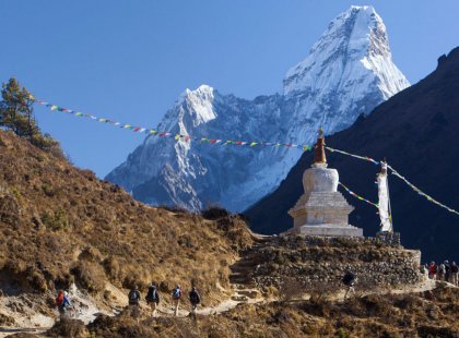 Trails are adorned with colorful prayer flags and dotted with sacred stupas, symbols of the Sherpa people's deep devotion.