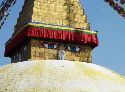 Experience the bustling city of Kathmandu under the towering gaze of the Baudhanath stupa, the largest of its kind in the world.