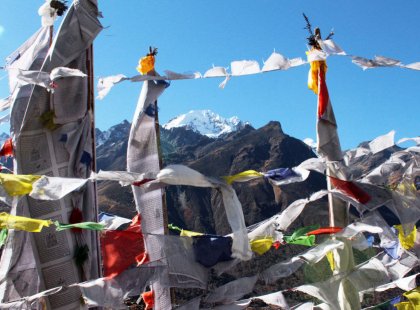 Colorful prayer flags line our path through the Himalayan peaks of the Langtang.