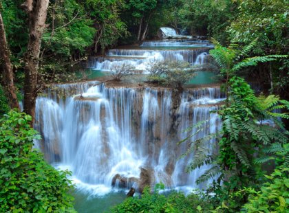 Enjoy a dip in the cascading waterfalls of Erawan National Park.