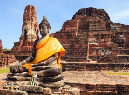 In the ancient capitol of Ayutthaya, we visit ancient wats (temples) and Buddha statues, where saffron-robed monks are often encountered.