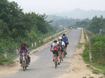 We'll see the Vietnamese countryside while cycling from village to village on many different backroads, like this one on the way to Quy Nhon.