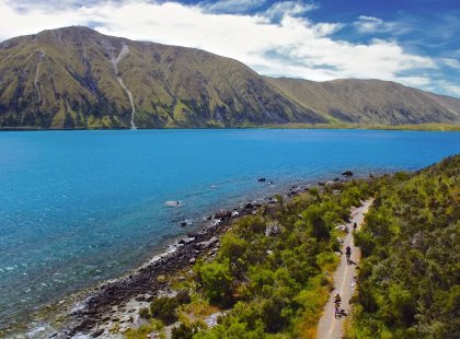 The Alps 2 Ocean Cycle Trail offers up-close views of Lake Ohau, as well as sweeping views of the Southern Alps and a glimpse of Aoraki/Mount Cook.