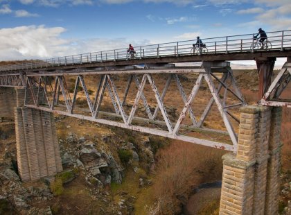 We ride sections of the Central Otago Rail Trail over old railway viaducts and through historic tunnels. The stone pillars of the Poolburn Viaduct are considered the most impressive on the route.