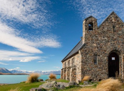 Visit the iconic Church of the Good Shepherd, whose altar window frames an idyllic scene of Tekapo Lake and the peaks beyond.
