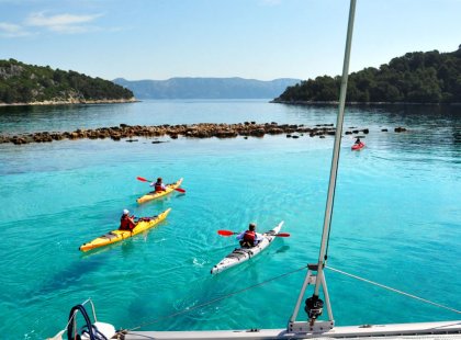 Explore the Dalmatian Coast by catamaran and kayak, swim and stand up paddle board.