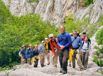 Fellow travelers enjoy a photo op while hiking through Paklenica National Park.