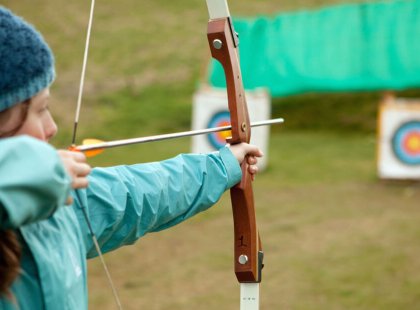 Try to hit the bull’s-eye during our private archery lesson.