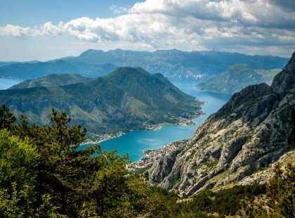 We follow the coastal transversal route offering magnificent views such as this one overlooking the Bay of Kotor and dramatic limestone landscapes.