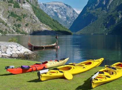 As we prepare for our adventure in the Fjords, our kayaks rest near a more ancient form of transportation.