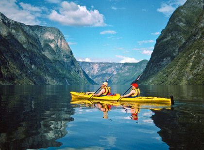 The Naeroyfjord is an idyllic spot for our paddle, with typically calm water and plunging waterfalls cascading from the fjord's 3,500-foot-high walls.