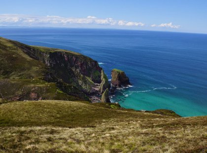 The rugged highland coastline offers miles of beautiful cliffs and sea stacks.