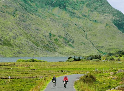 Wild rivers, lakes, and heather-covered mountains provide a lovely backdrop as we cycle through Connemara.
