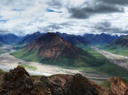 Denali’s vast stretches of tundra, jagged peaks and on clear days, 20,320-foot Denali itself, combine to create a dramatic landscape of enormous scale and unforgettable beauty.