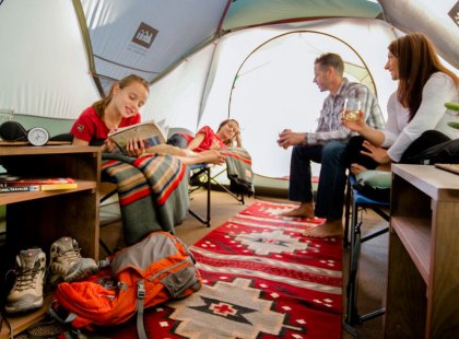 Our spacious tents are ideal for hanging out and having fun, with custom furniture and cozy décor.