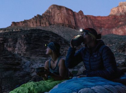 Backpackers enjoy warm drinks, solitude and epic twilight views.
