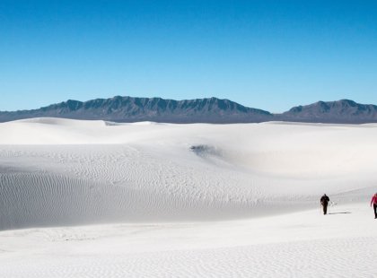 Play in White Sands National Monument’s otherworldly landscape of stark white gypsum sand, hiking and sand sledding amid the dune fields.