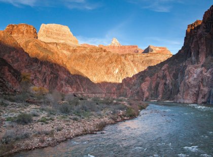 The West’s most iconic river, the legendary Colorado, marks our arrival at canyon bottom.