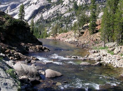 We hike along the rushing Tuolumne River as it slices its way through Yosemite’s dramatic granite landscape and camp on the river’s tranquil banks at night.