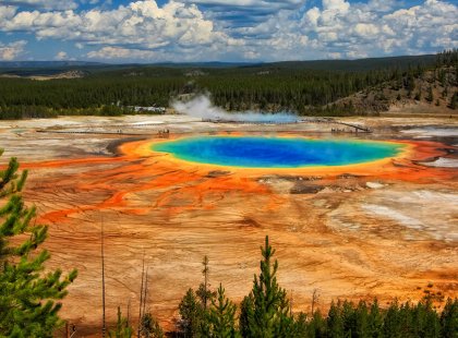 Marvel at the brilliant natural colors of the Grand Prismatic Spring, the largest hot spring in the United States.