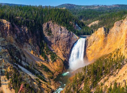 Yellowstone’s abundance of natural wonders include thundering waterfalls, vast rolling grasslands, and soaring peaks that tower over the surrounding plains.