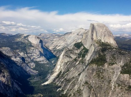 Half Dome, one of Yosemite National Park’s granite icons, rises above Yosemite Valley and the surrounding landscape.