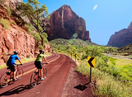 We ride the Floor of the Valley Road along the glistening Virgin River to soak up Zion's fantastic vistas.