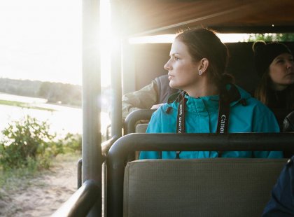 Traveller on a safari in Chobe National Park in Botswana on an Intrepid Travel tour.