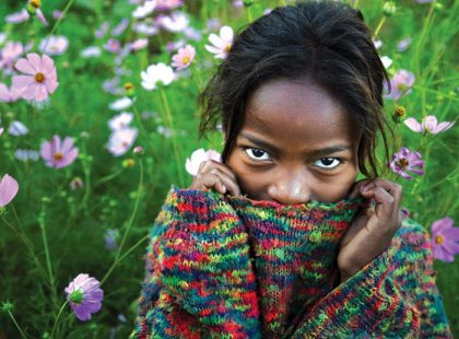 Local girl in a colourful jumper, Madagascar