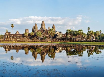 View of Angkor Wat over the lake in Cambodia on an Intrepid Travel tour.
