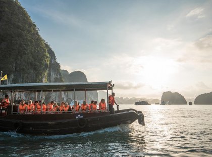 Group of travellers on a boat tour through Halong Bay, Vietnam